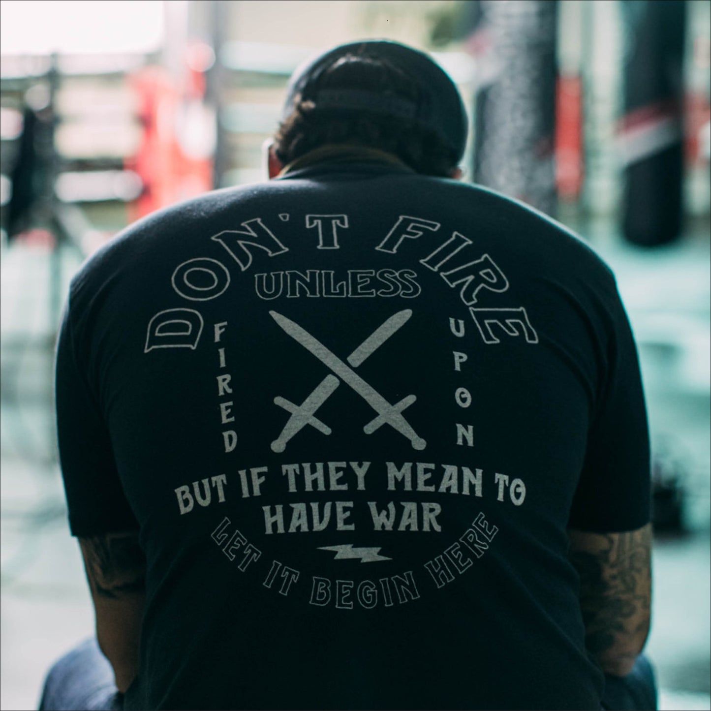 DON'T FIRE UNLESS FIRED UPON TEE BLACK ON BODY BACK